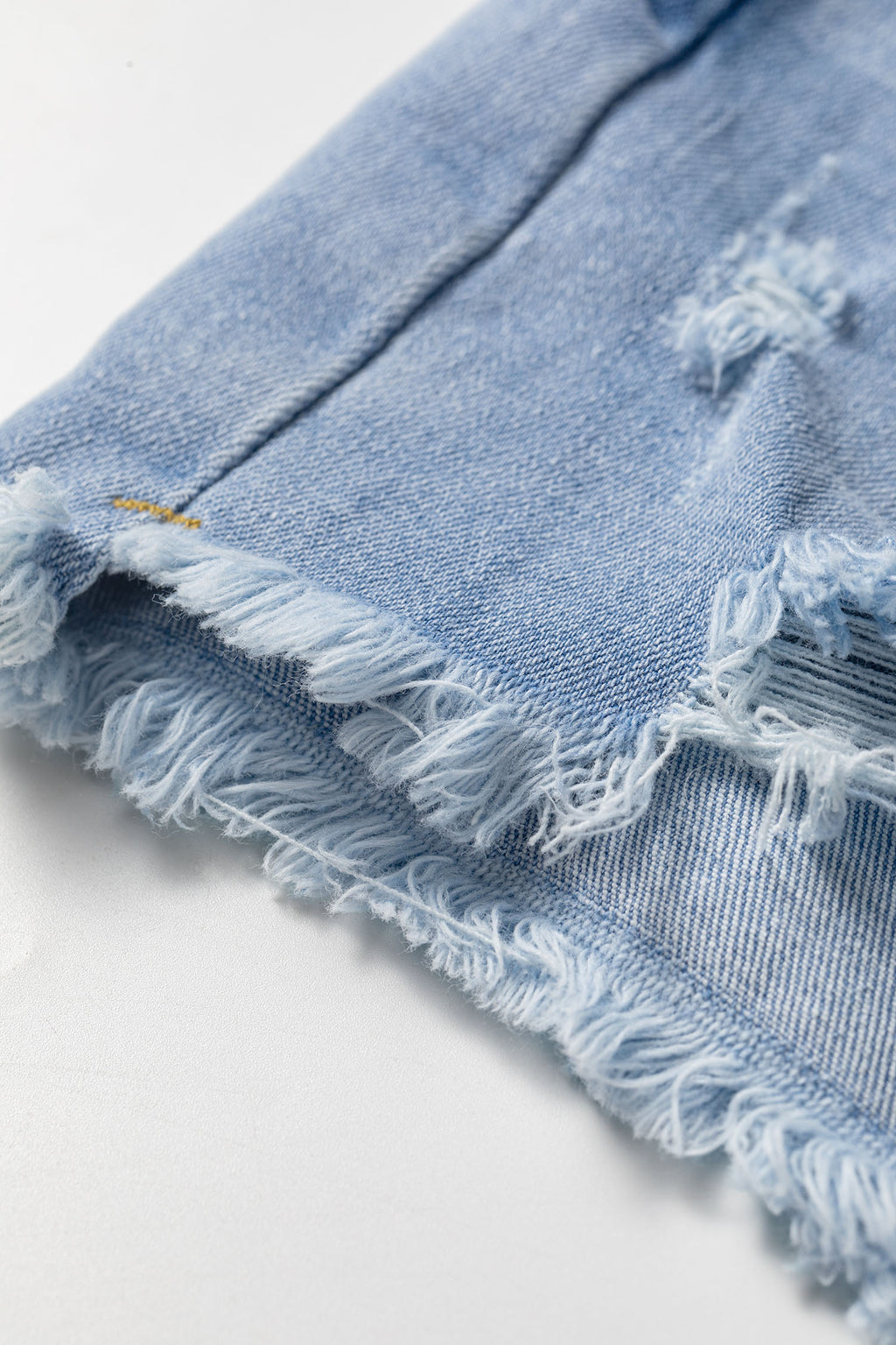 Sail Blue Asymmetric Raw Hem Distressed Whiskery Denim Shorts